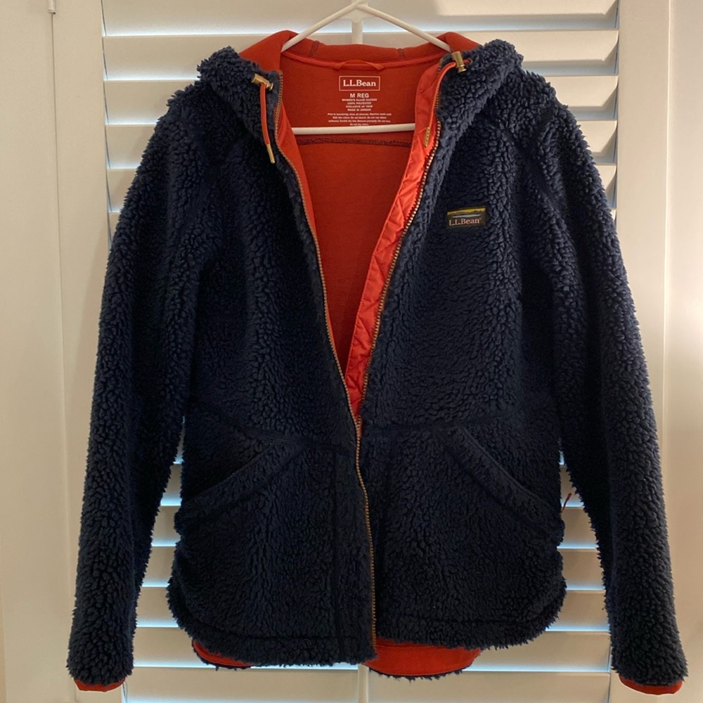 LL Bean Navy Fleece jacket w/ hood, orange trim, zippered pockets.Like new MED.